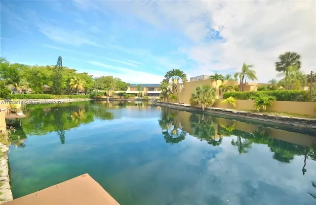 a view of a lake with houses in outdoor space