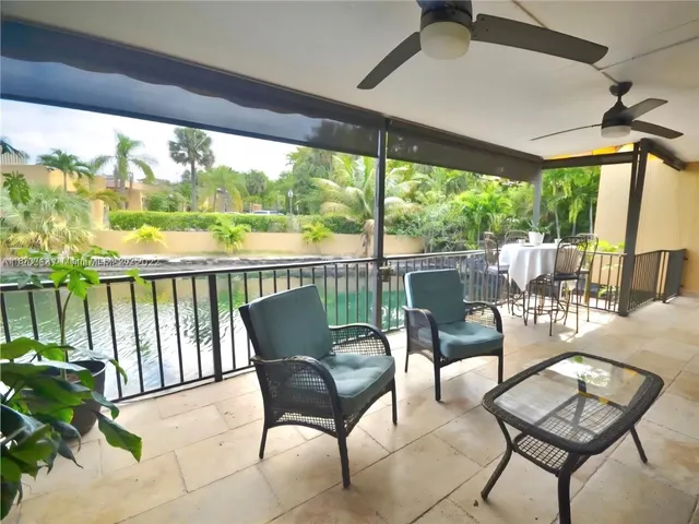 a view of a chairs and table in patio