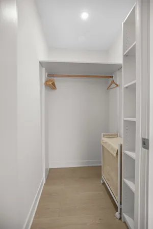 a view of storage and utility room with washer and dryer