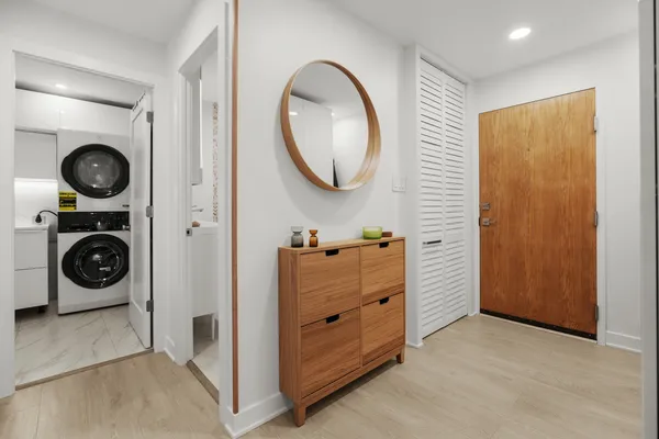 a view of a hallway with washer and dryer