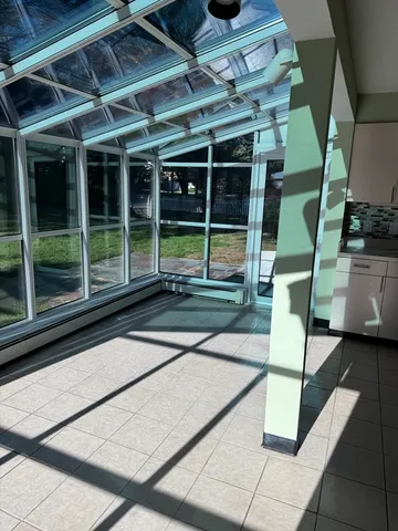 a view of a swimming pool with a yard