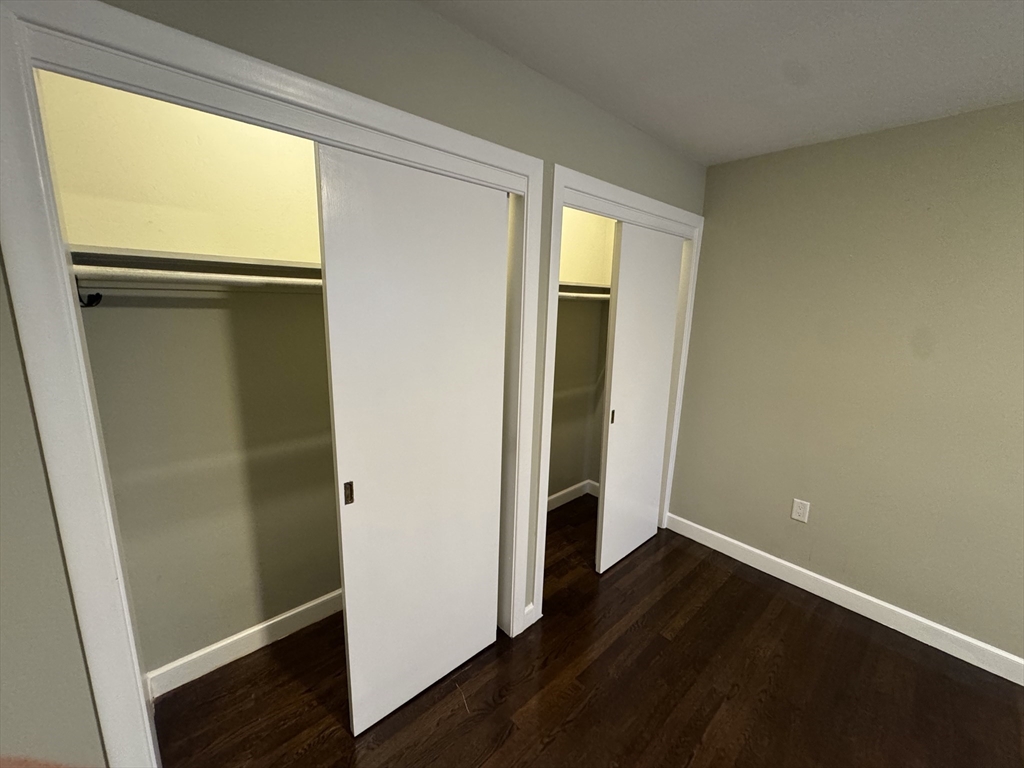 793 Dedham Street Newton, MA 02459 - Photo 16 of 26 an empty room with wooden floor and a window