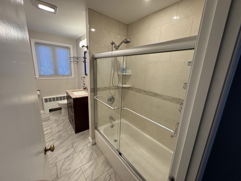 793 Dedham Street Newton, MA 02459 - Photo 17 of 26 a bathroom with a shower and a sink