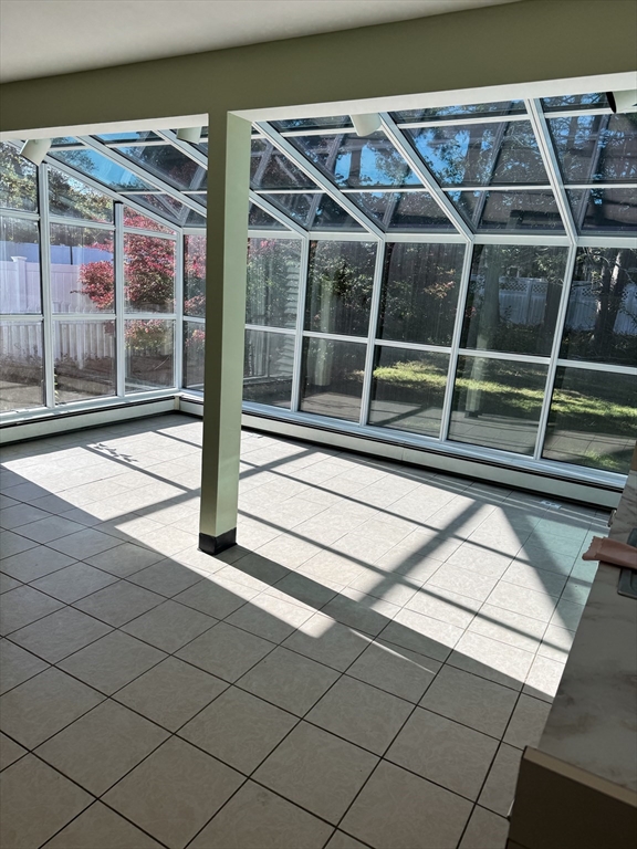 793 Dedham Street Newton, MA 02459 - Photo 7 of 26 a view of house with a large window and wooden floor
