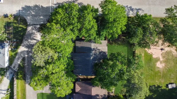 an aerial view of house with yard and outdoor seating