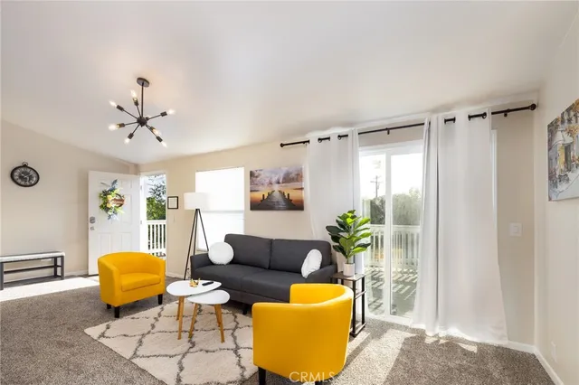 a kitchen with stainless steel appliances a white table and chairs