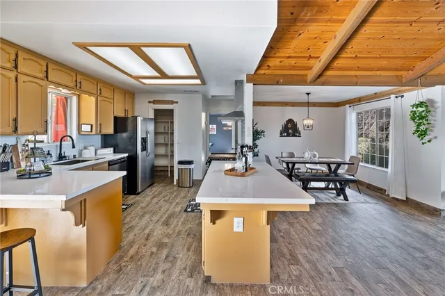 a view of a living room and kitchen