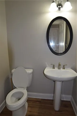 a bathroom with a toilet and a sink