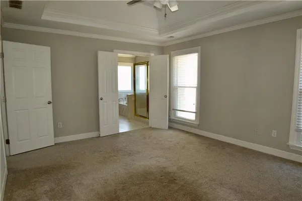 a view of an empty room with a window