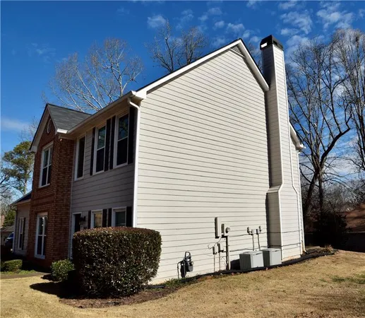 a view of a house with a yard