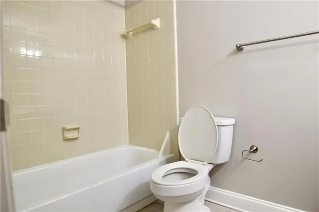 a bathroom with a sink a toilet and a bathtub