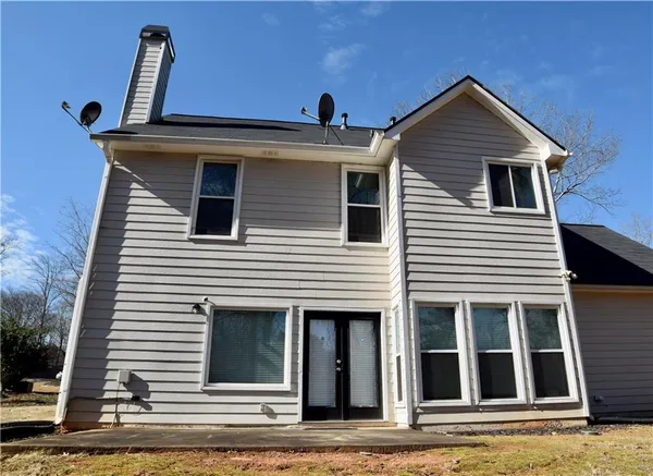 a view of a house with a window and wooden floor