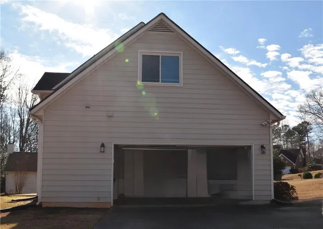 a front view of house with garage