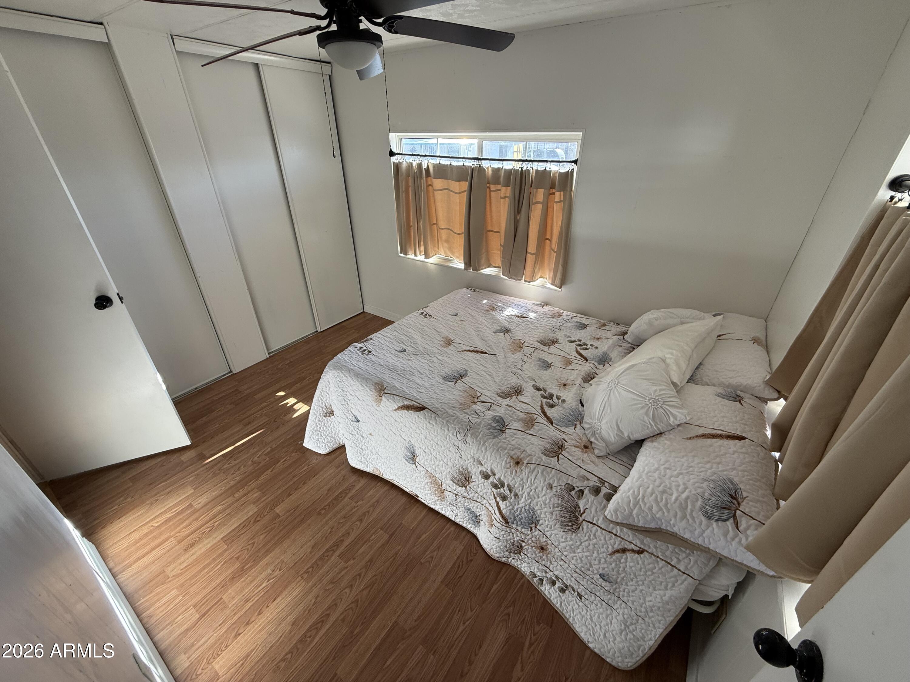 9501 East Broadway Road, Unit 48 Mesa, AZ 85208 - Photo 6 of 12 a bedroom with a bed and a window