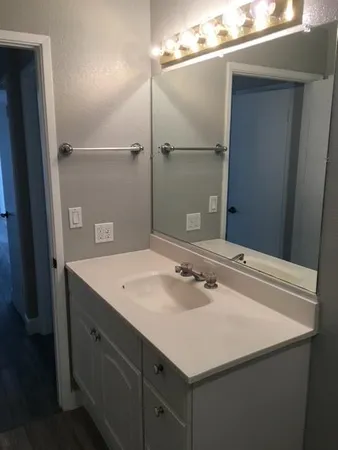 a bathroom with a sink and a mirror