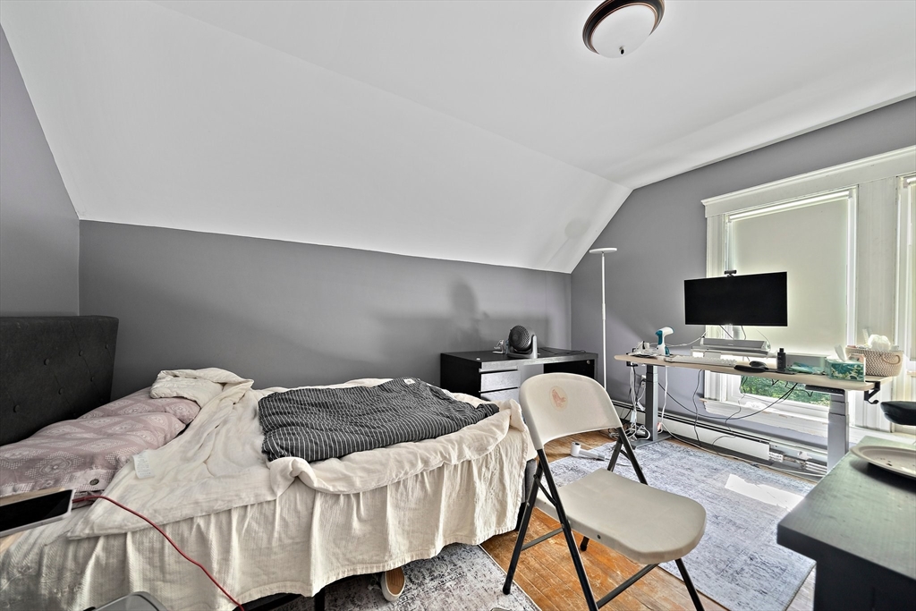 10 Trowbridge Road Worcester, MA 01609 - Photo 17 of 38 a bedroom with a bed and a flat screen tv