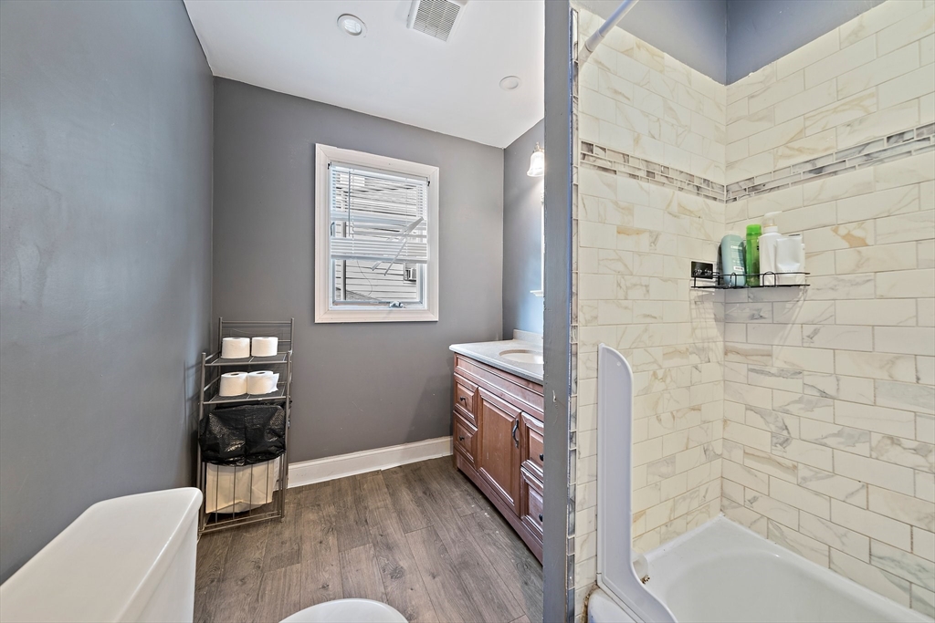 10 Trowbridge Road Worcester, MA 01609 - Photo 19 of 38 a bathroom with a bathtub sink and a toilet