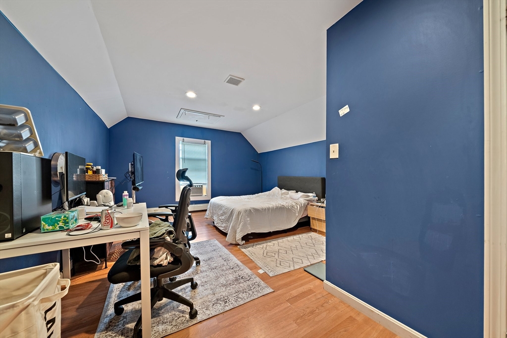 10 Trowbridge Road Worcester, MA 01609 - Photo 24 of 38 a living room with furniture and a flat screen tv