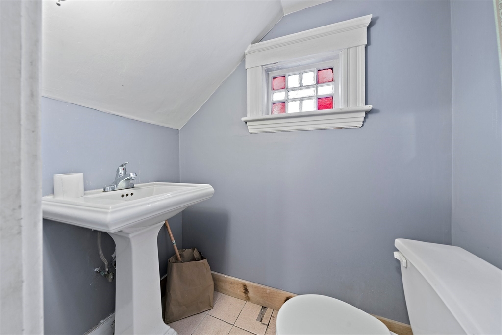 10 Trowbridge Road Worcester, MA 01609 - Photo 27 of 38 a bathroom with a toilet a sink and mirror
