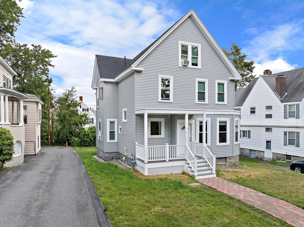 10 Trowbridge Road Worcester, MA 01609 - Photo 3 of 38 a front view of a house with a yard and porch
