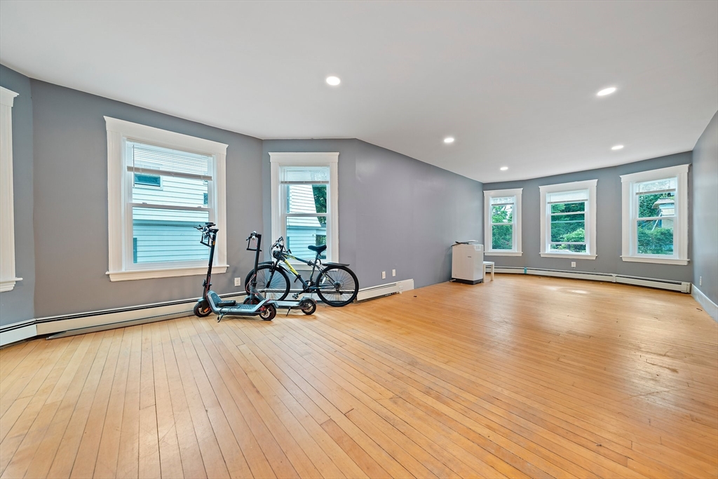 10 Trowbridge Road Worcester, MA 01609 - Photo 10 of 38 a view of a room with gym equipment and large windows