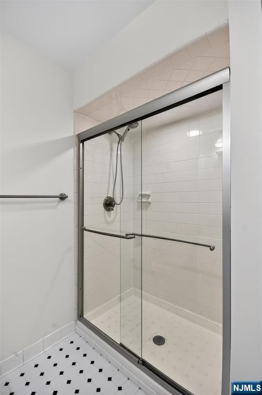 260 Prospect Street, Unit 12 Westfield, NJ 07090 - Photo 11 of 14 a bathroom with a glass shower door
