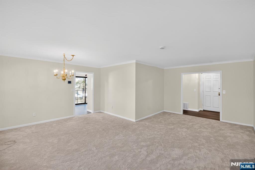 260 Prospect Street, Unit 12 Westfield, NJ 07090 - Photo 5 of 14 a view of a big room with windows and chandelier fan