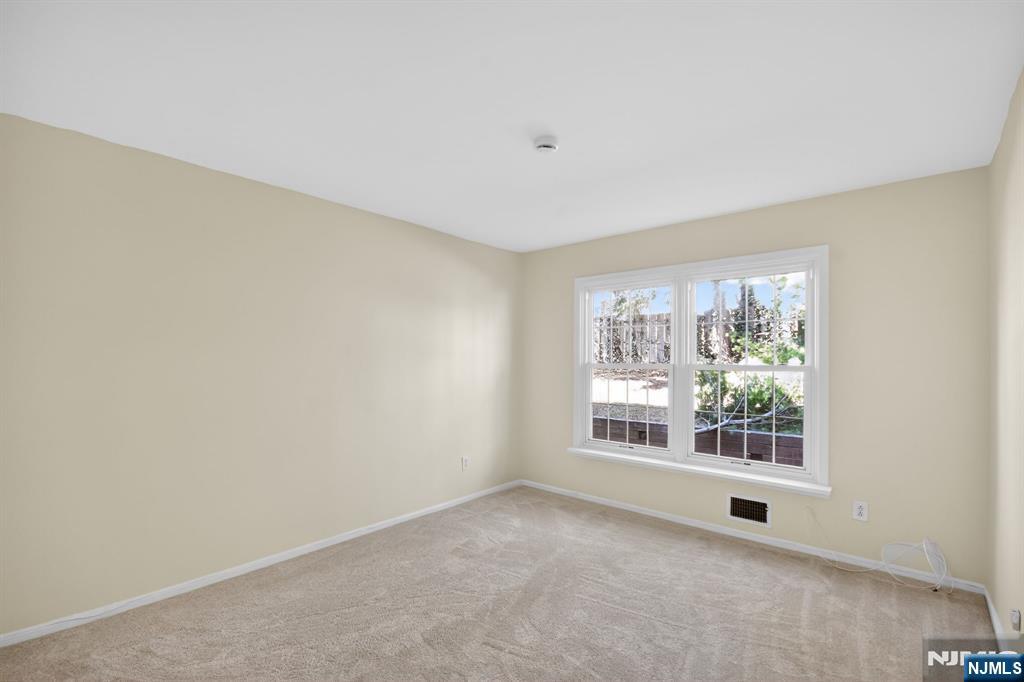 260 Prospect Street, Unit 12 Westfield, NJ 07090 - Photo 6 of 14 a view of an empty room with a window