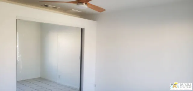 a view of an empty room and window