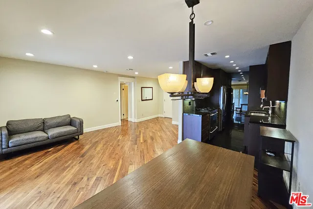 a view of a living room and kitchen