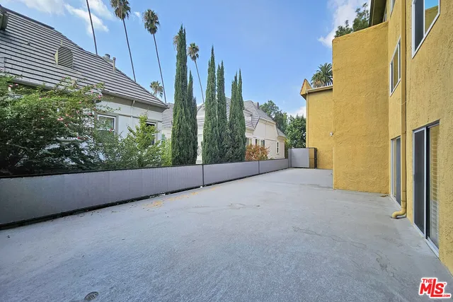 a view of a back yard of the house