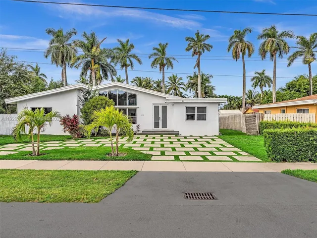 a view of a house with a street
