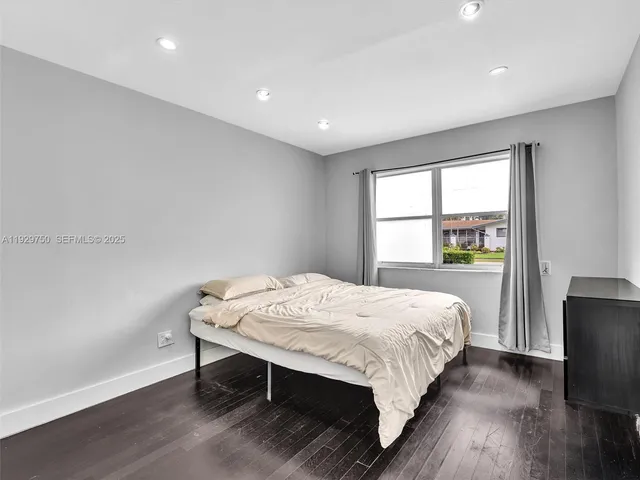 a bedroom with a bed and a table in it