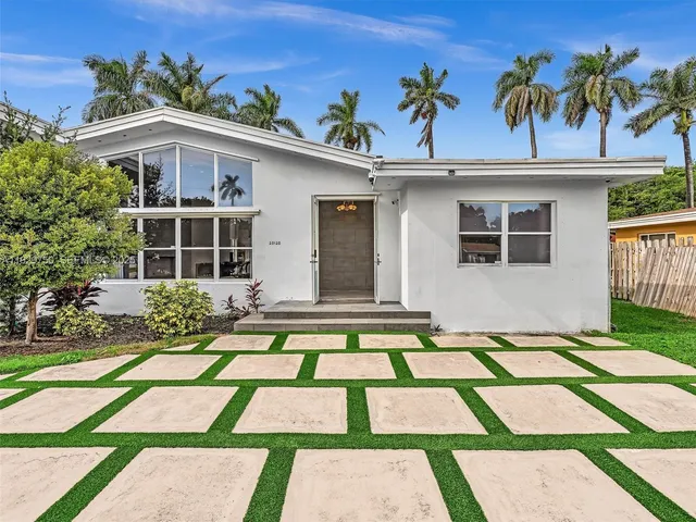a view of backyard of a house