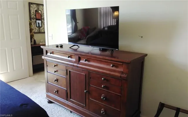 a room with furniture and mirror