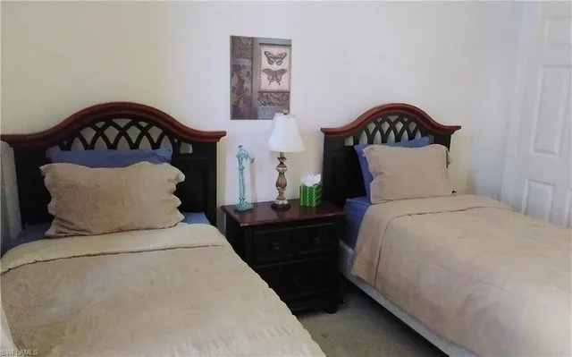a blue and white umbrella sitting in front of a house