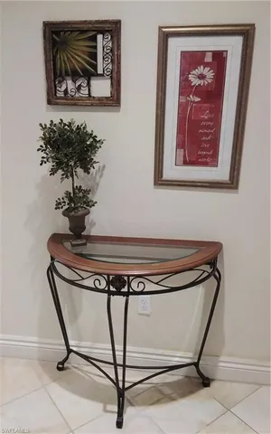 a view of a hallway with paintings on the wall