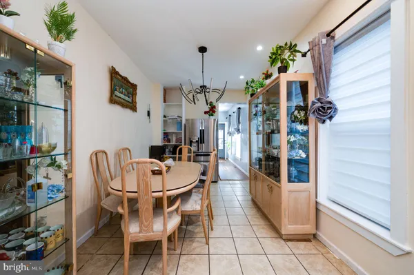 a dining room with furniture and window