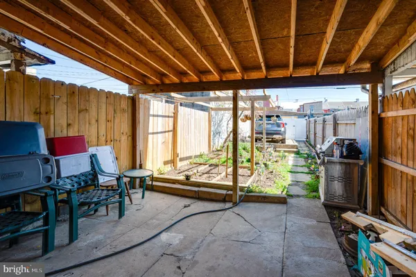 a outdoor space with lots of furniture and shower