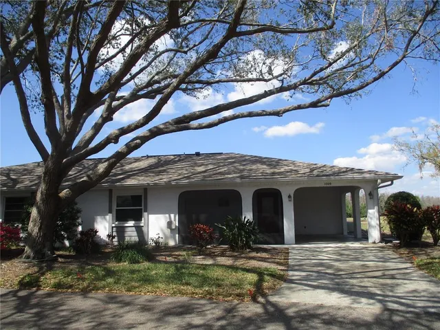 a front view of a house with yard