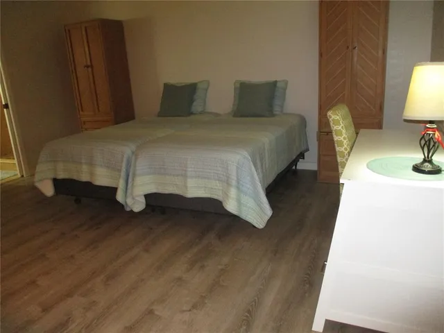 a bedroom with a bed and a table