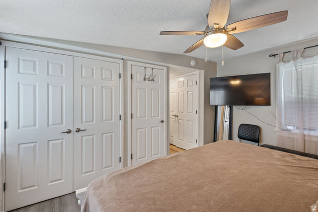 255 North 1600 West, Unit 60 Provo, UT 84601 - Photo 17 of 22 Bedroom with a closet, ceiling fan, and light wood-style flooring