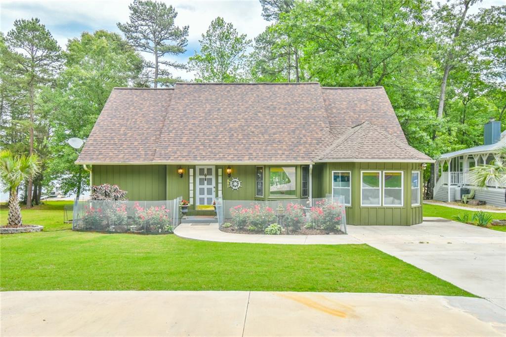 591 Rue Cezzan Lavonia, GA 30553 - Photo 1 of 36 a backyard of a house with table and chairs