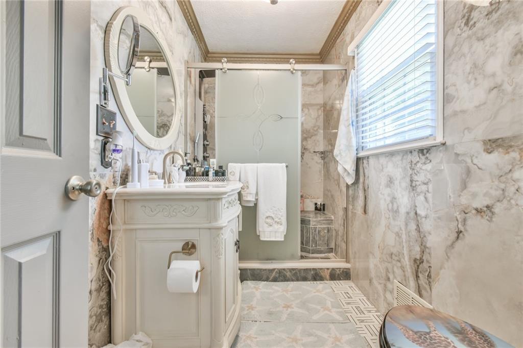 591 Rue Cezzan Lavonia, GA 30553 - Photo 11 of 36 a bathroom with a sink vanity mirror and toilet
