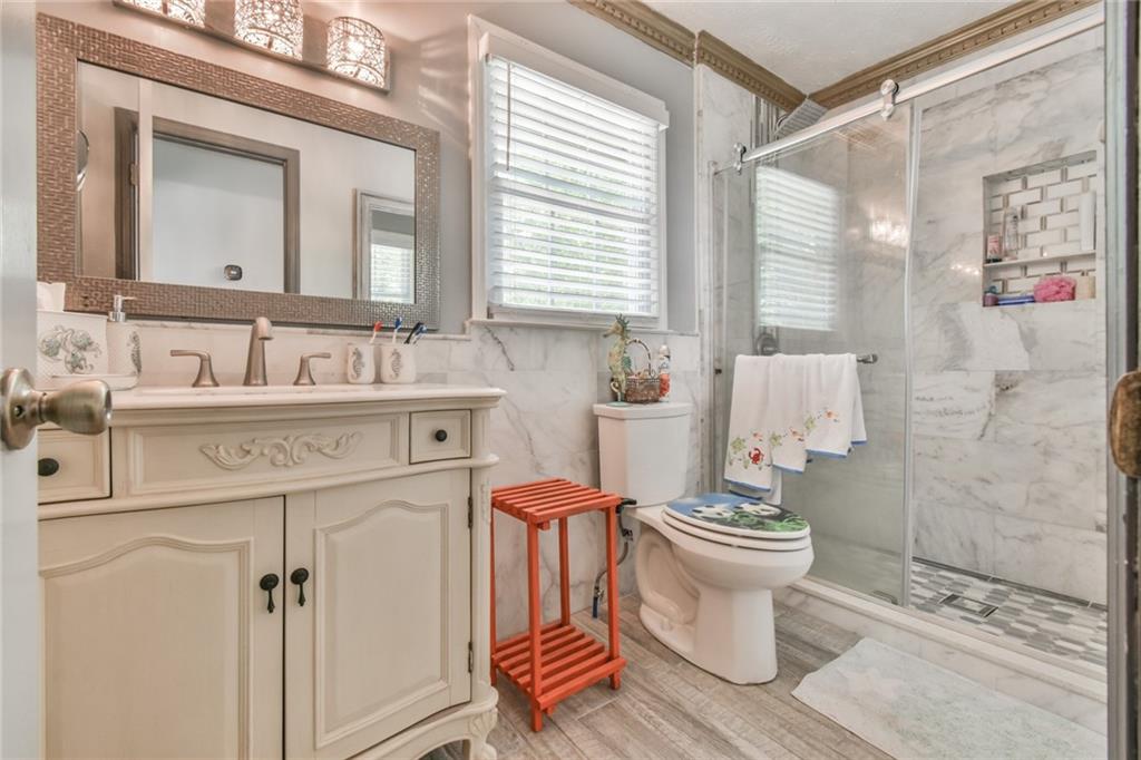 591 Rue Cezzan Lavonia, GA 30553 - Photo 19 of 36 a bathroom with a sink toilet and shower