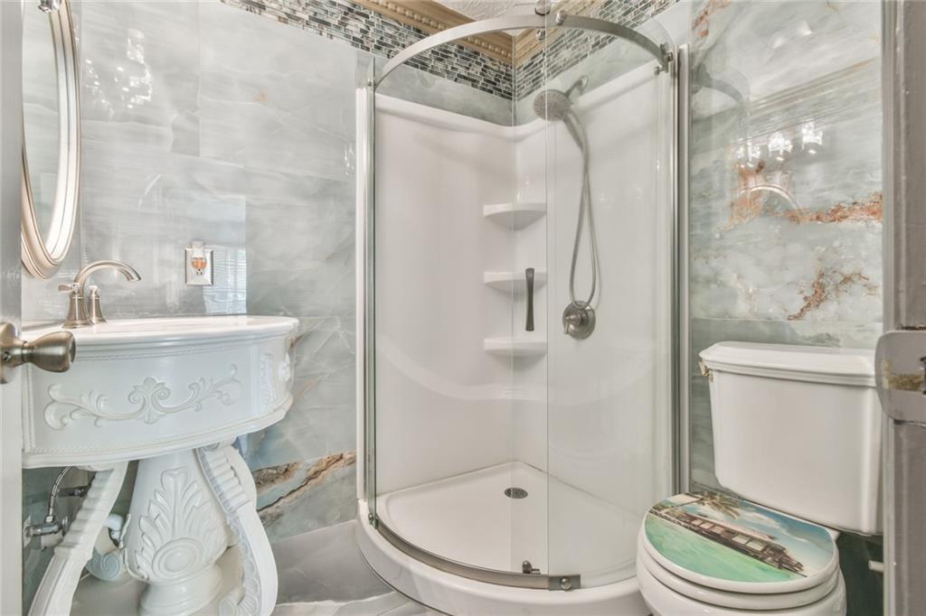 591 Rue Cezzan Lavonia, GA 30553 - Photo 21 of 36 a bathroom with a sink toilet and shower