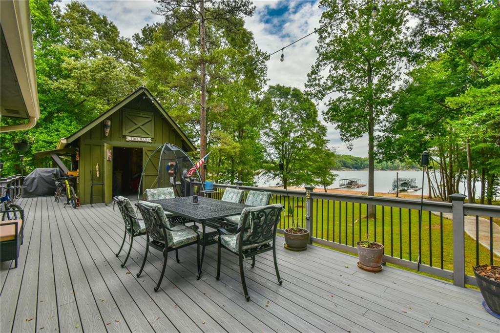 591 Rue Cezzan Lavonia, GA 30553 - Photo 25 of 36 a view of a deck with furniture and trees