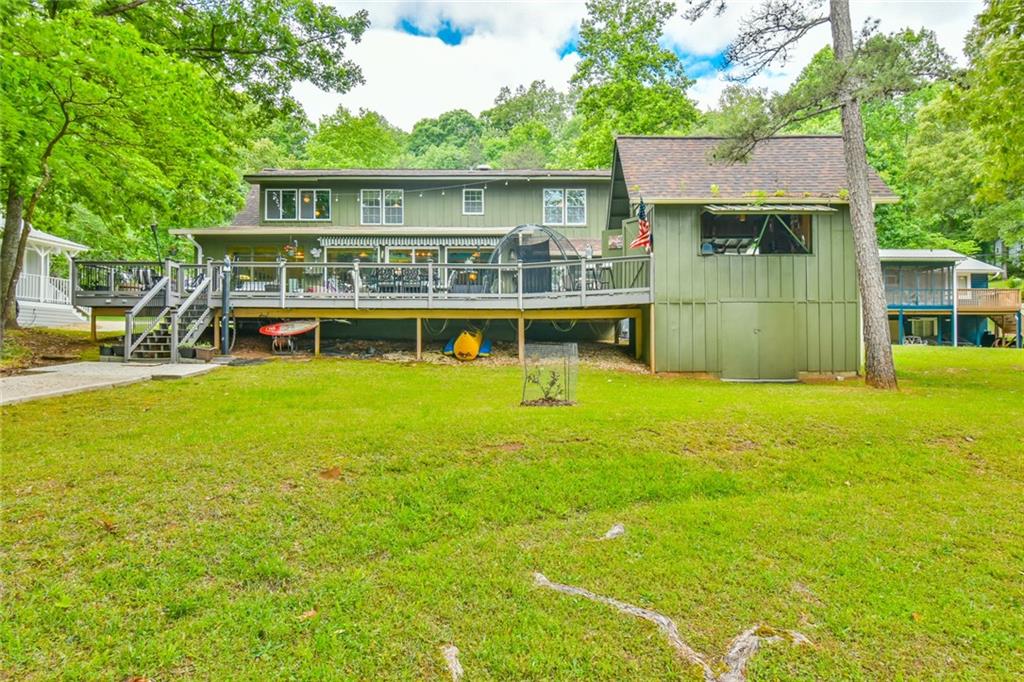 591 Rue Cezzan Lavonia, GA 30553 - Photo 28 of 36 a view of an house with swimming pool garden and patio
