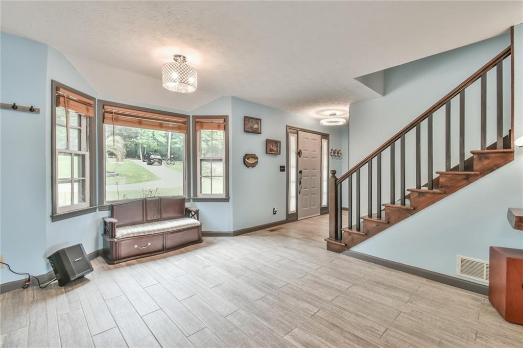 591 Rue Cezzan Lavonia, GA 30553 - Photo 5 of 36 a living room with furniture and a large window