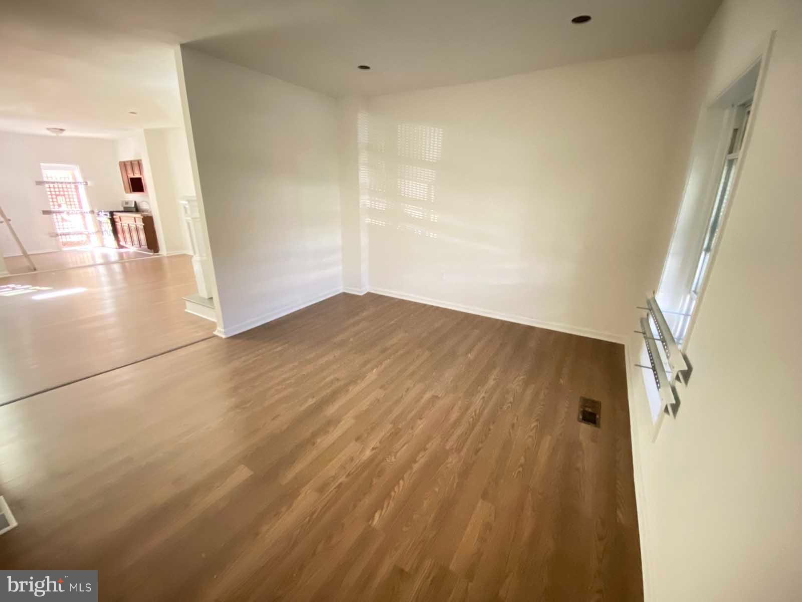 3015 Rayner Avenue Baltimore, MD 21216 - Photo 24 of 71 a view of a hallway with wooden floor